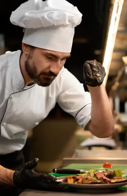 From Knowledge to the Kitchen: How the IIG MOOC is Transforming Edible Insect Gastronomy 2 From Knowledge to the Kitchen How the IIG MOOC is Transforming Edible Insect Gastronomy 2 a chef in the kitchen cooking something delicious