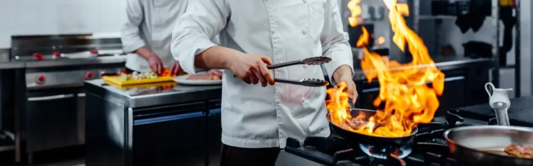 Two chefs cooking in the kitchen
