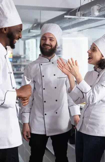 Ready to Explore Our Action Manual 1 Ready to Explore Our Action Manual 3 chefs talking in the kitchen